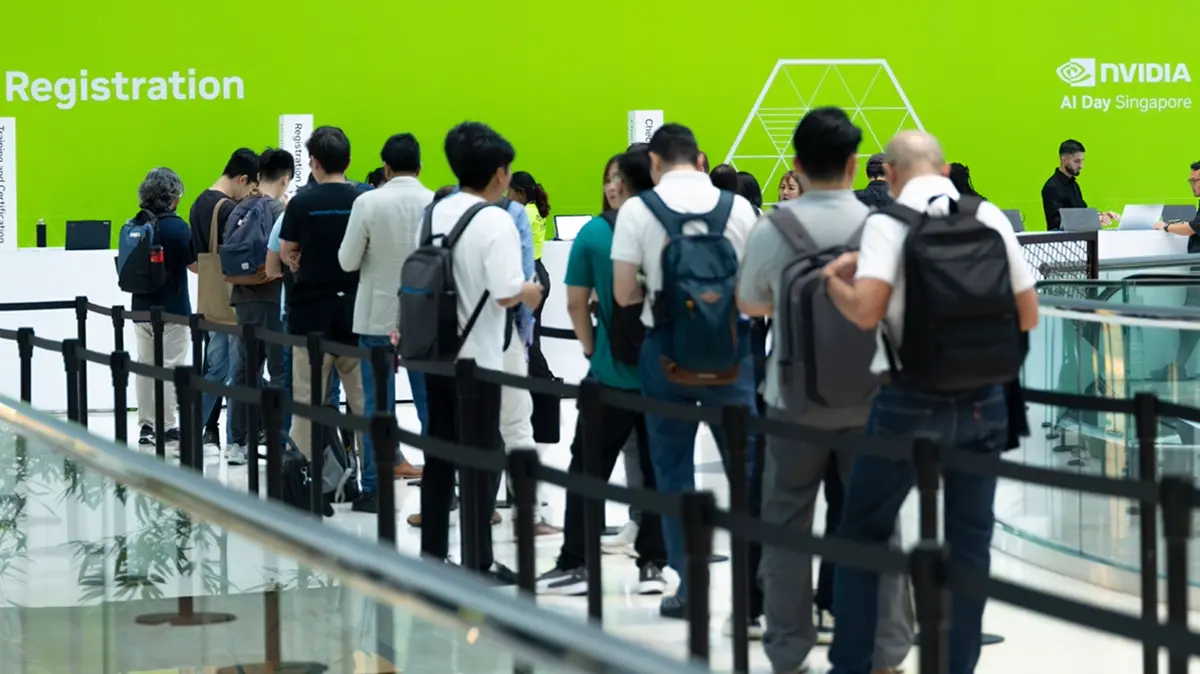 NVIDIA AI Day Singaporeの会場で受付に並ぶ参加者たちの写真