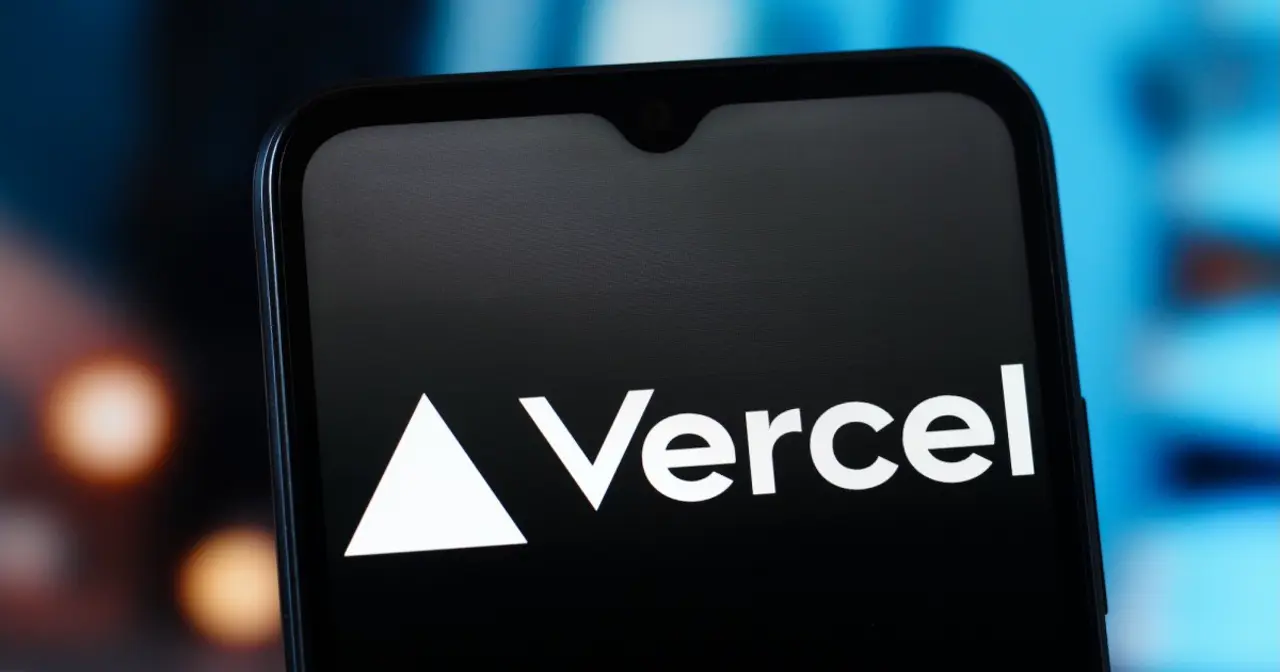 スマートフォンの画面にVercelのロゴが表示されている写真